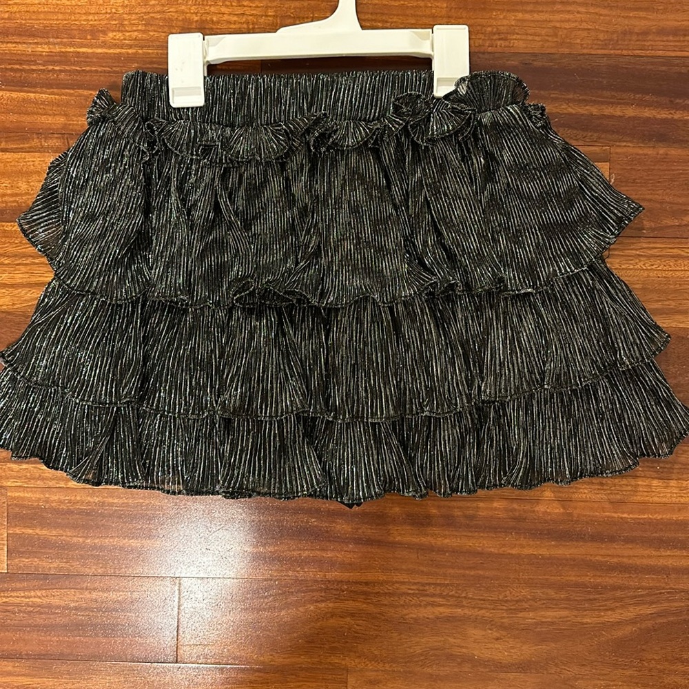 Boutique sold black and silver mini skort. (Small)